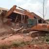 a tractor razing down a house by NEMA