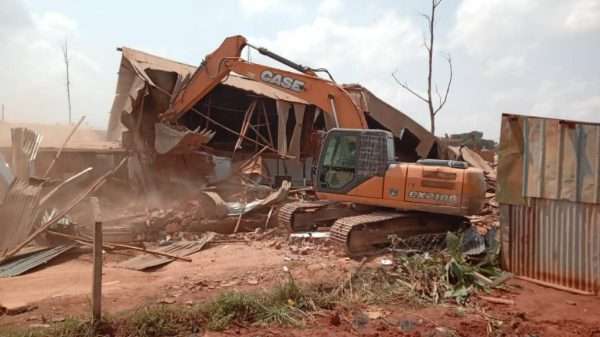 a tractor razing down a house by NEMA