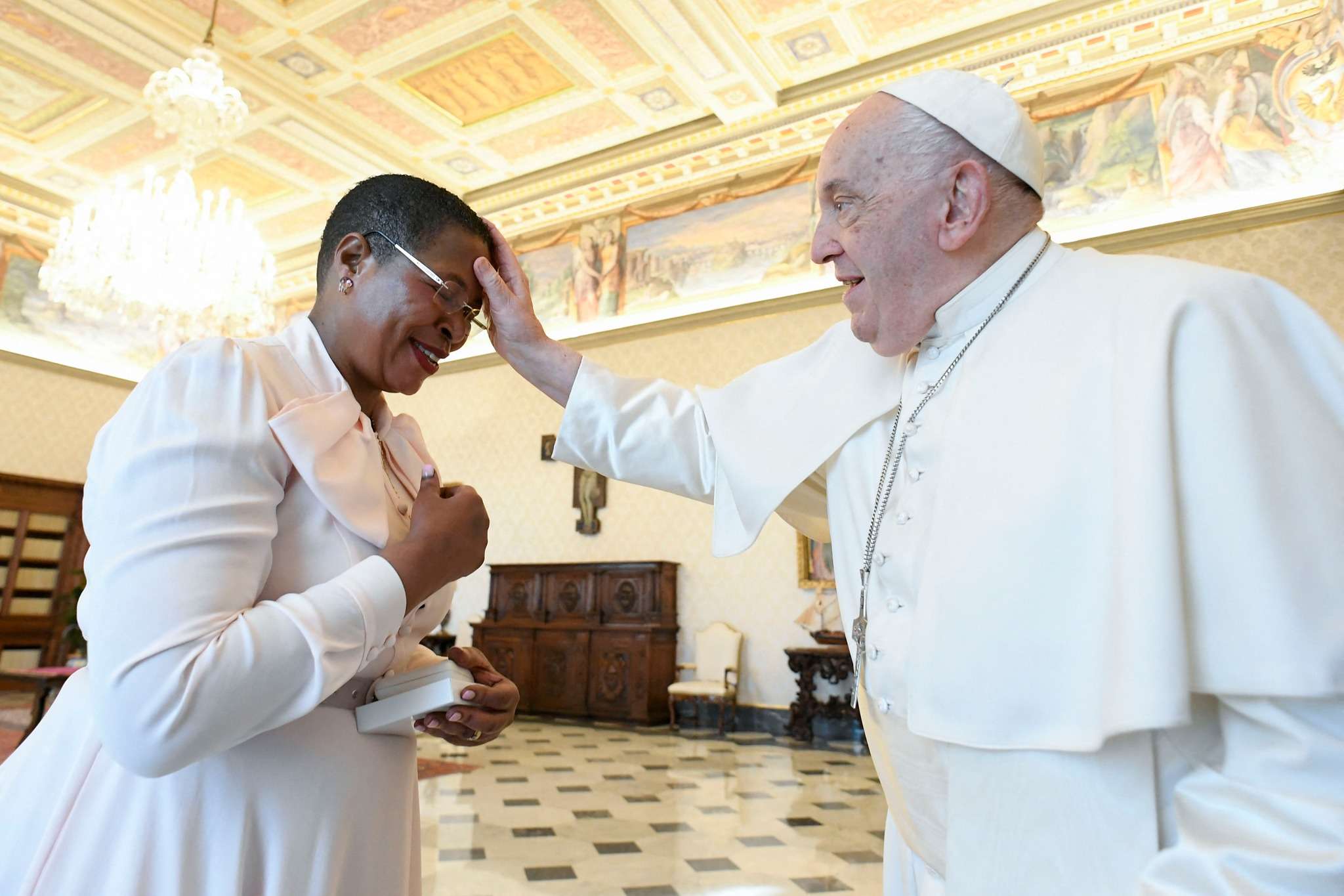 Pope Francis prays for Anita Among